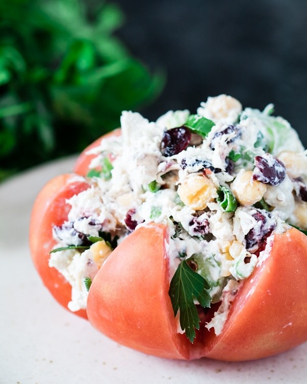 Chicken salad stuffed inside of a heirloom tomato.