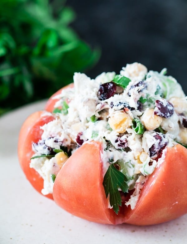 Chicken salad stuffed inside of a heirloom tomato.