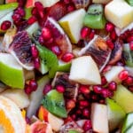 fruit mixed together - pomegranates, blood oranges, apples