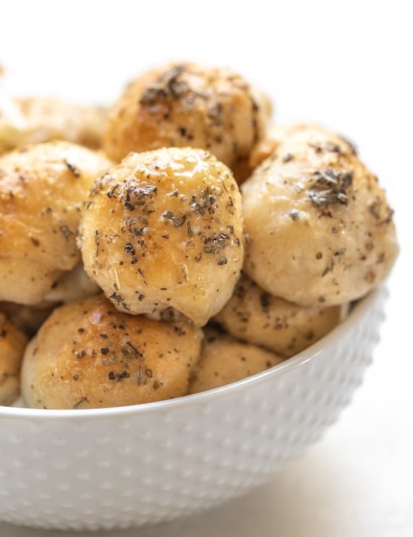 garlic herb cheese bites in a white bowl