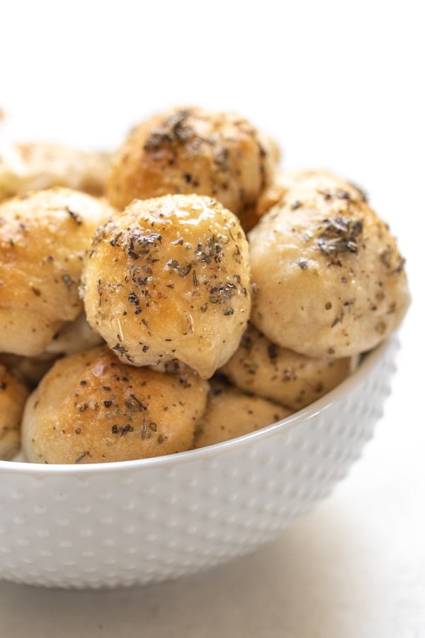 garlic herb cheese bites in a white bowl