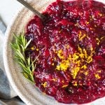 cranberry sauce in a bowl topped with orange zest