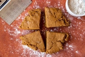 rolled out gingerbread cookie dough split into quarters