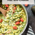 mac and cheese in a pan topped with cherry tomatoes