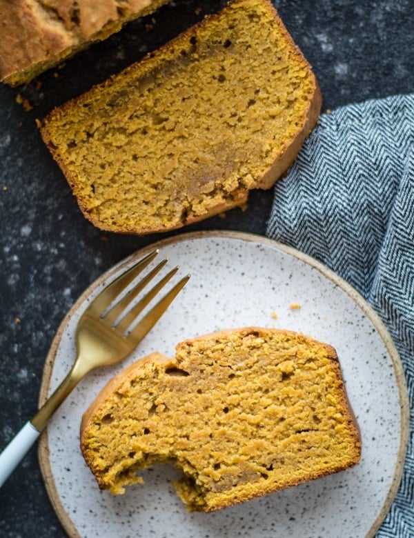 Pound cake on a plate with a fork and a napkin