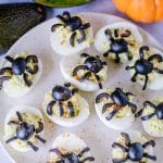 Halloween Deviled Eggs on a cream colored plate.
