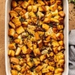 overhead shot of sausage mushroom stuffing in a white casserole dish
