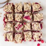 cranberry oatmeal bars on parchment paper