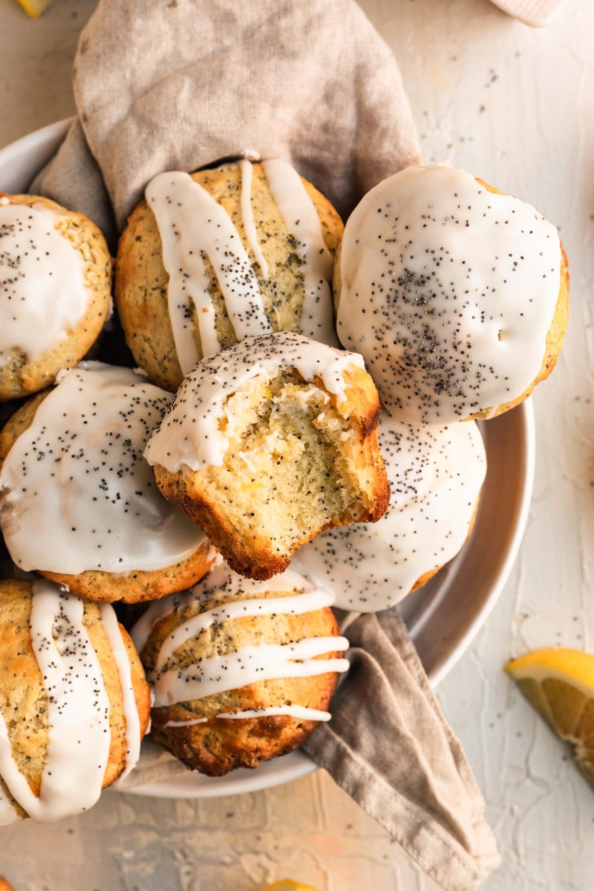 Lemon muffins with poppyseeds and a vanilla glaze.