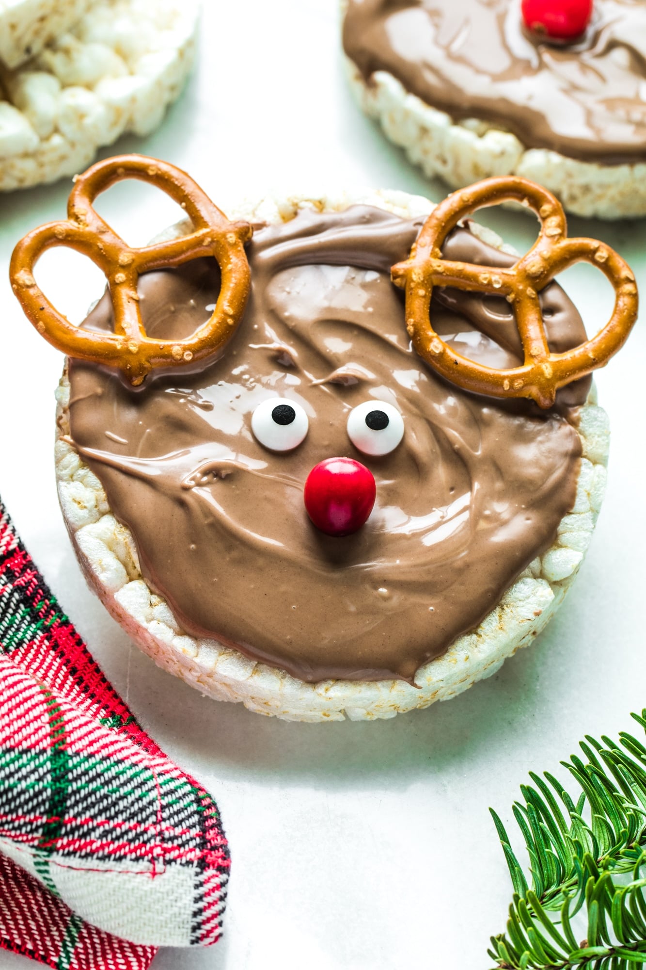 A rice cake with white chocolate and nutella on top