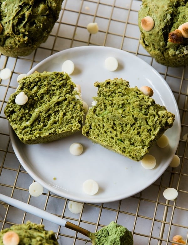 Muffins made with matcha and avocado on a white plate.