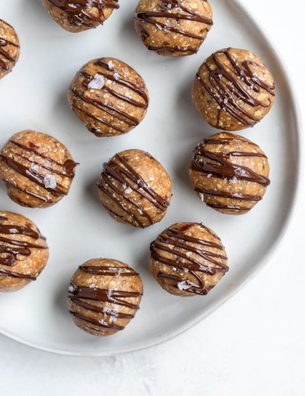 energy balls drizzled with chocolate and flaky sea salt
