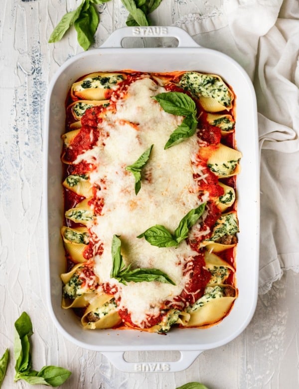 jumbo shells stuffed with cheese and topped with marinara and fresh basil