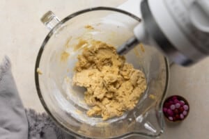 cookie dough in a glass mixing bowl.