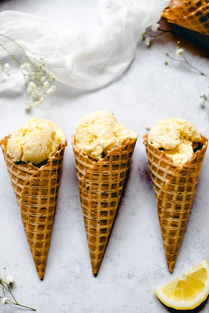 Lemon ice cream in a waffle ice cream cone 