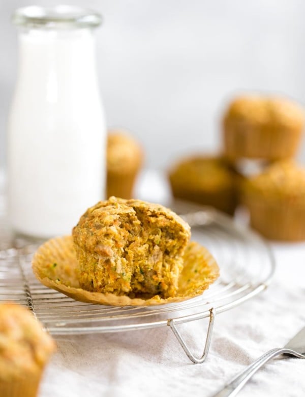 zucchini carrot muffin on a cooling rack