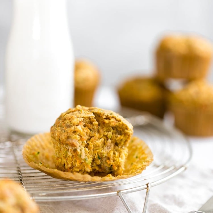 zucchini carrot muffin on a cooling rack