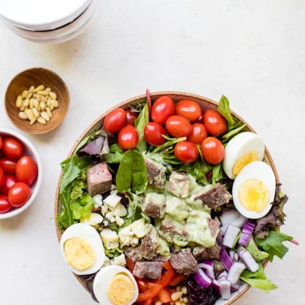 steak cobb salad on a white board