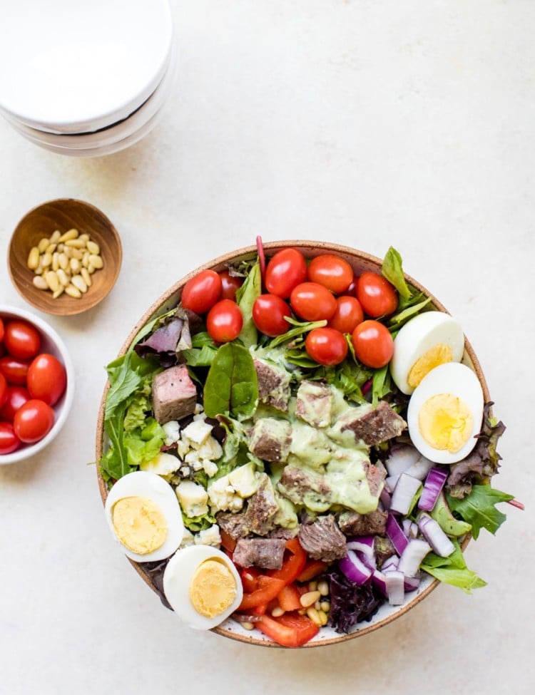steak cobb salad on a white board