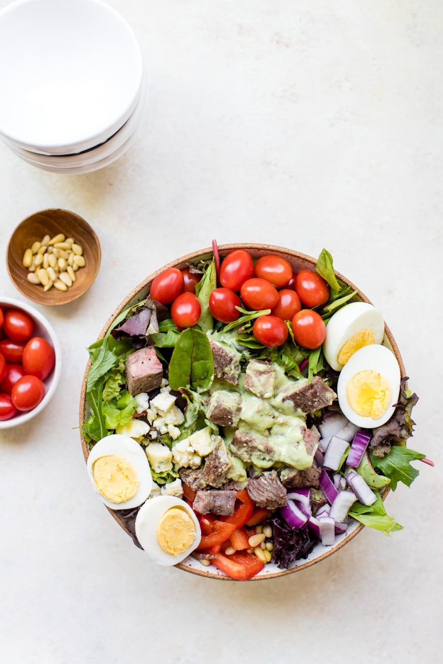 steak cobb salad on a white board