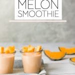 a melon smoothie in a glass jar on a wood board