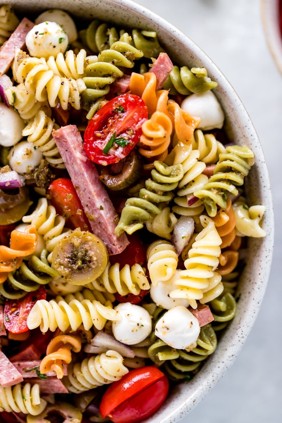 ingredients for Italian Pasta Salad in a large glass bowl.