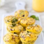 egg muffins stacked on a white cutting board