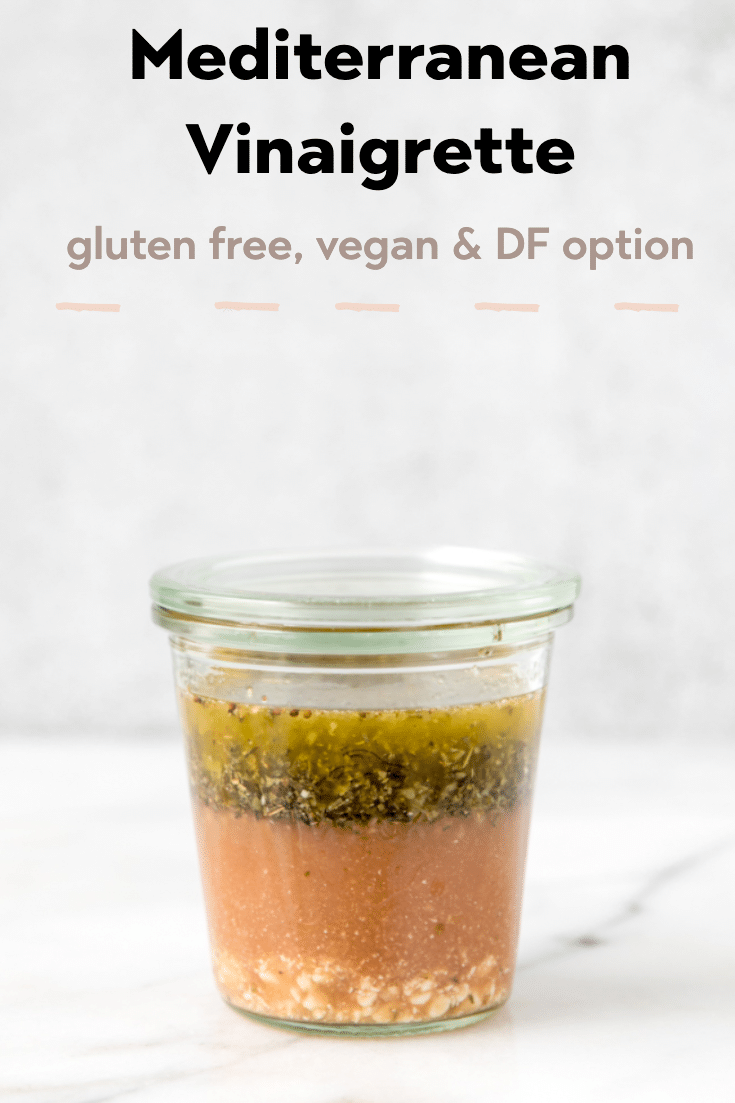 Greek salad dressing in a glass jar.