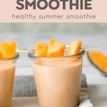 a melon smoothie in a glass jar on a wood board