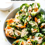 gluten free chicken summer rolls cut in half in a white bowl
