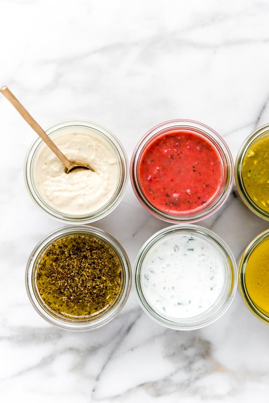 summer salad dressings in glass jars.