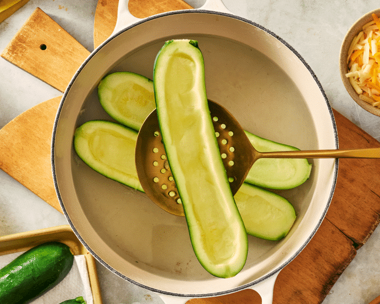 Blanching the zucchini for 1-2 minutes in boiling water.