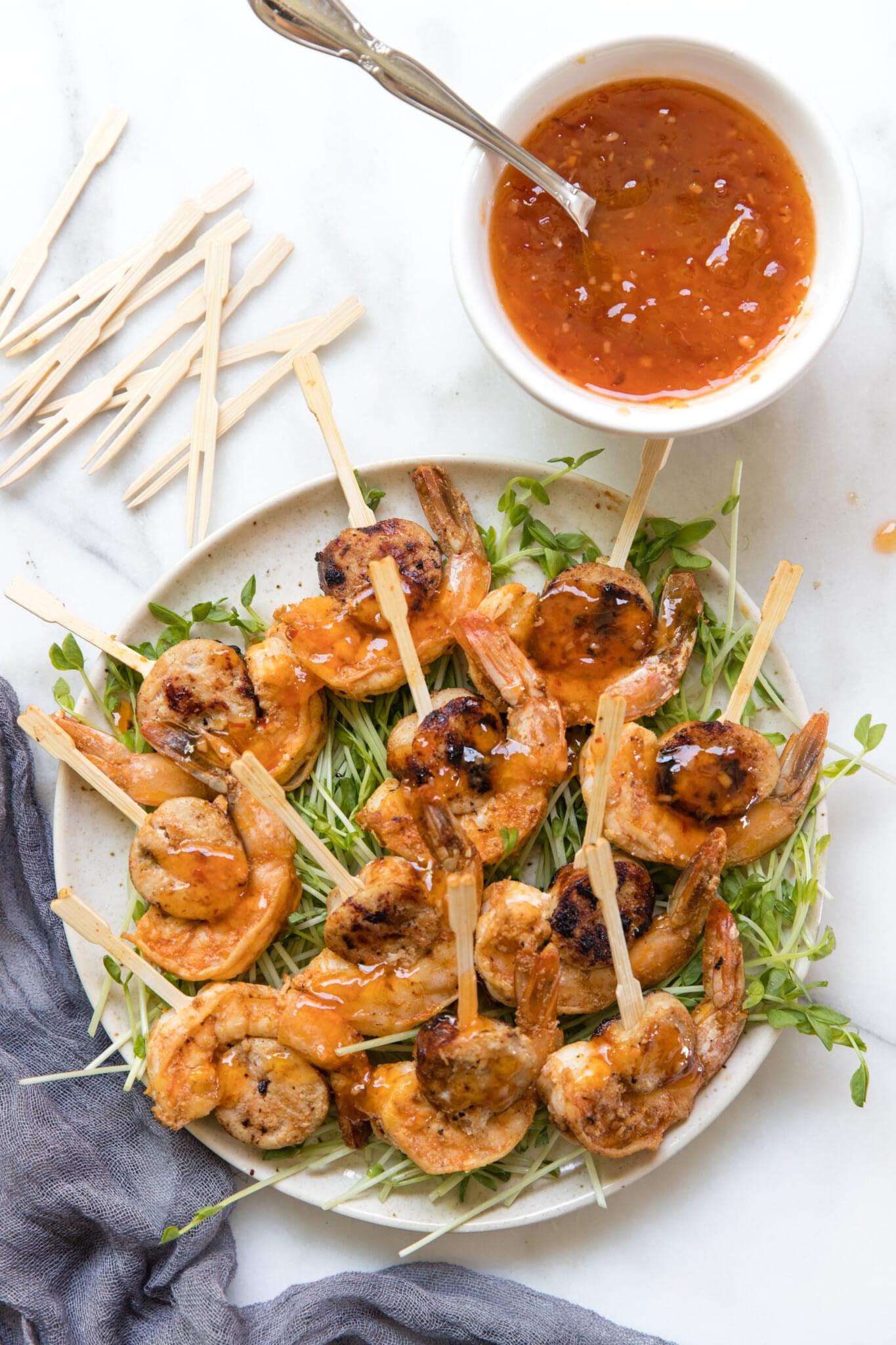 sausage and shrimp on a toothpick with microgreens