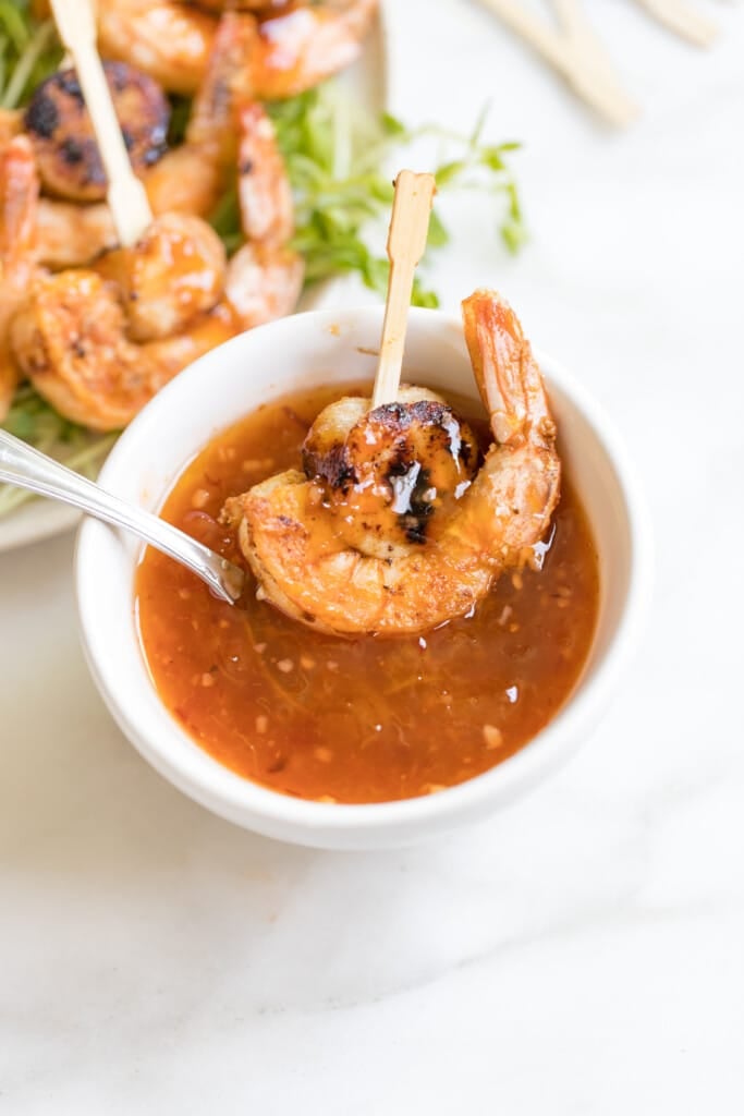 sausage shrimp skewer in dipping sauce