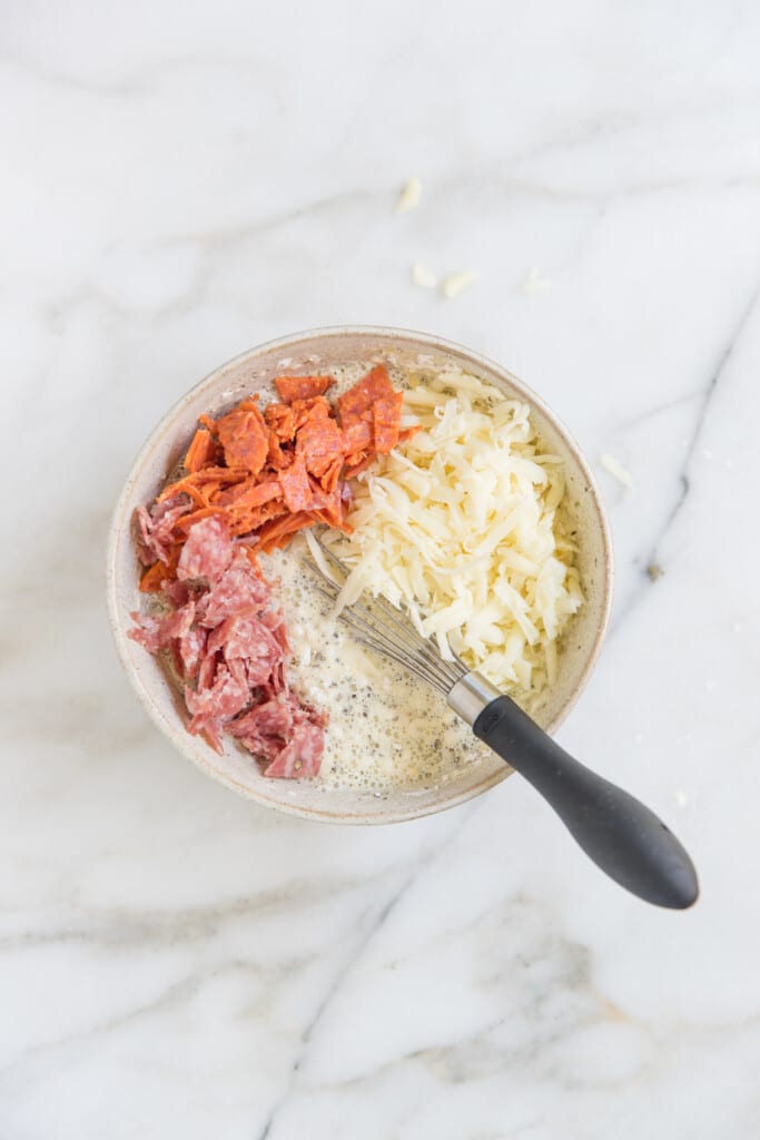 ingredients for Italian Pizza Bites in a mixing bowl