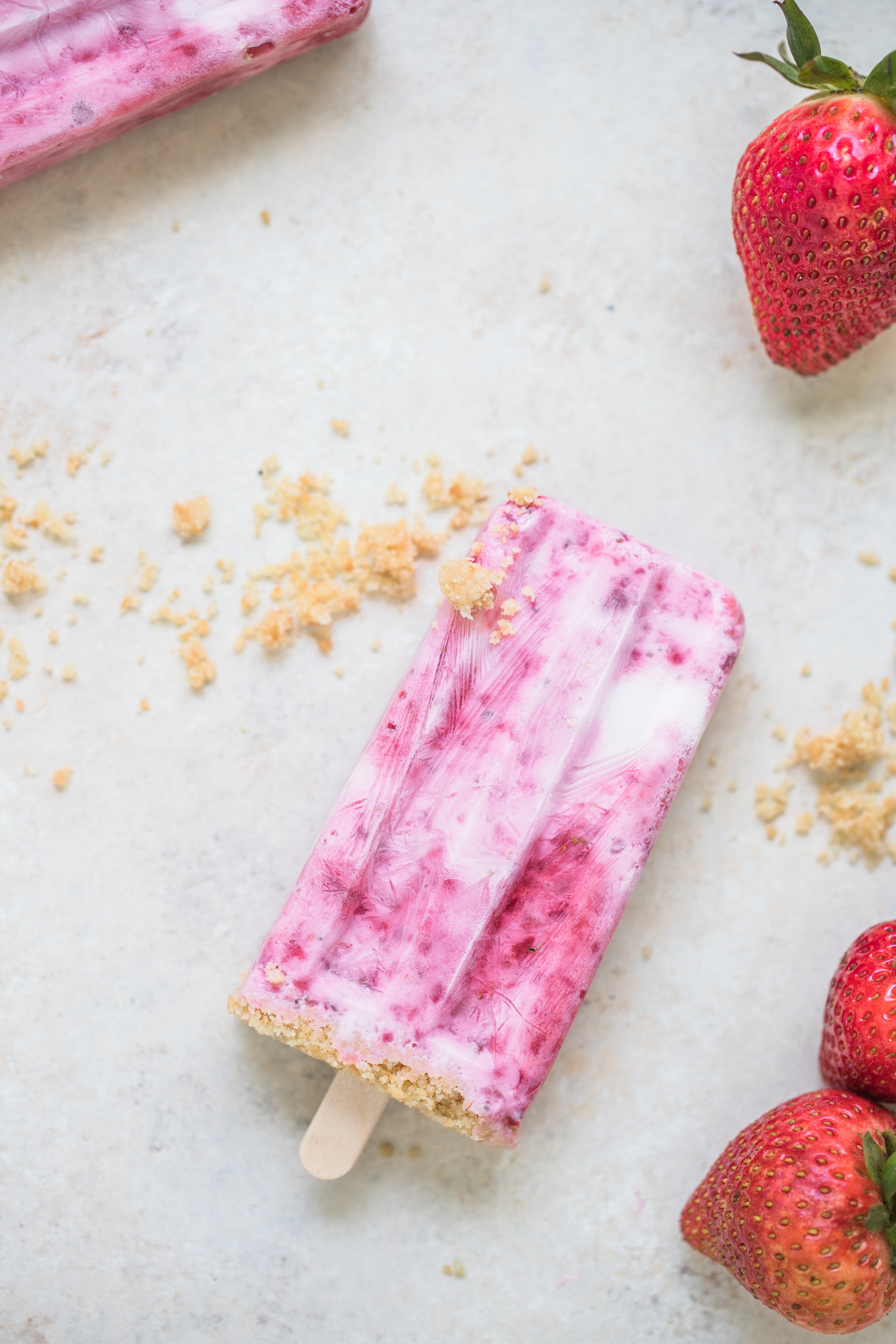 strawberry shortcake popsicles on a white board