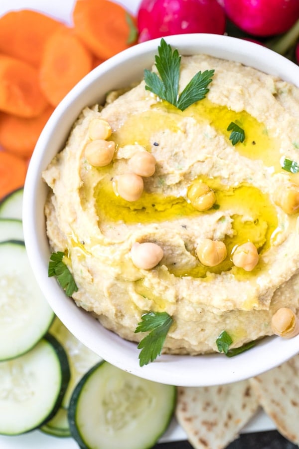 creamy hummus made with tahini in a white bowl