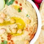 creamy hummus made with tahini in a white bowl