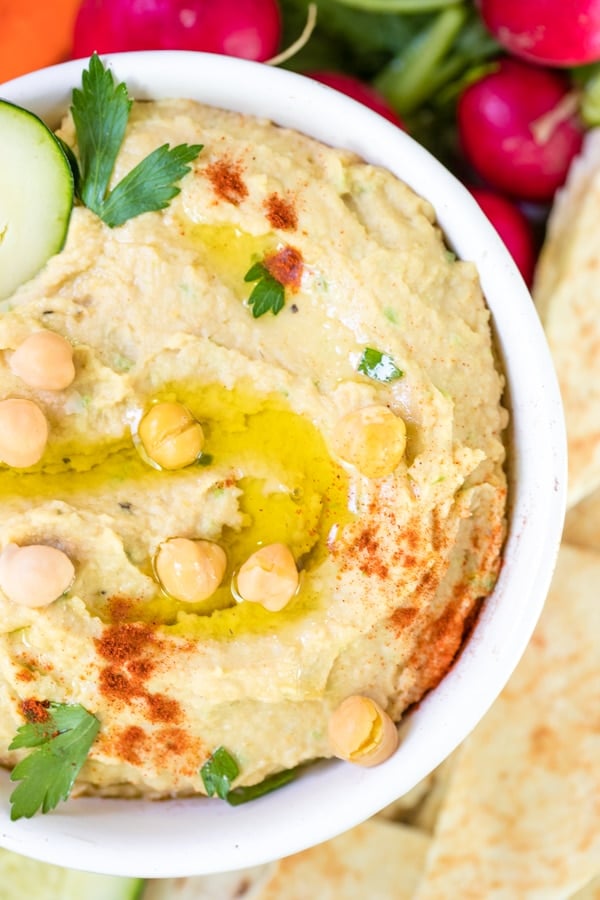 creamy hummus made with tahini in a white bowl