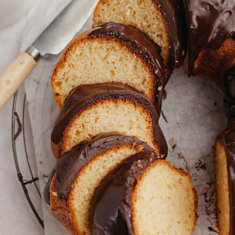 slices of rum bacardi bundt cake with chocolate ganache.