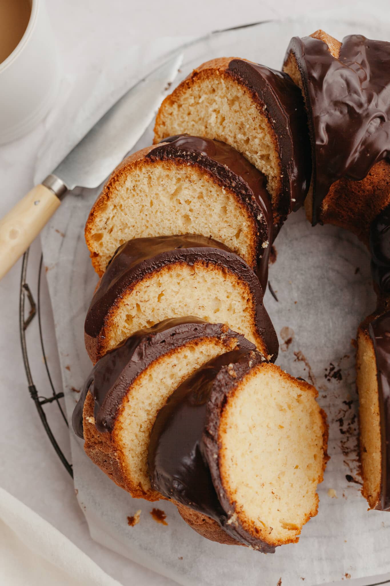 slices of rum bacardi bundt cake with chocolate ganache.