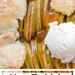 a baked apple galette on parchment paper with apricot jam