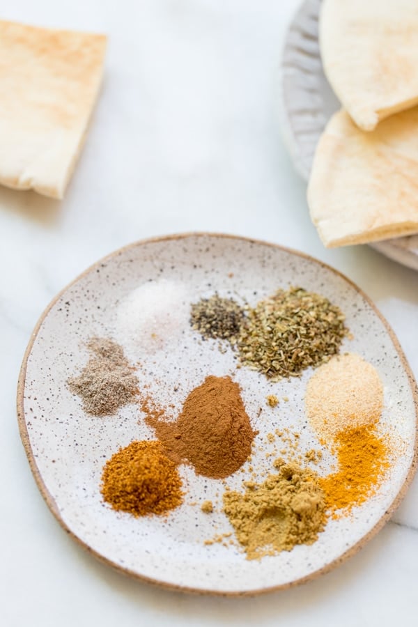 seasonings for chicken shawarma marinade on a plate