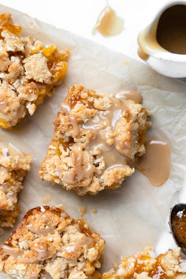apricot bars made with coconut and drizzled with caramel sauce