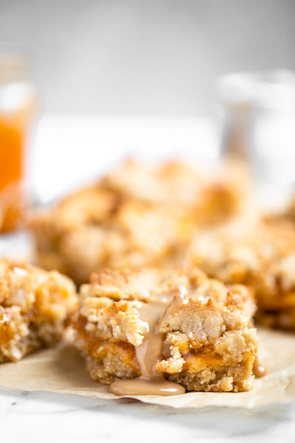 homemade apricot bars on a white board