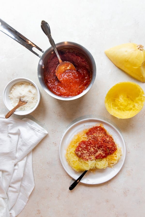 cooked spaghetti squash on a white plate