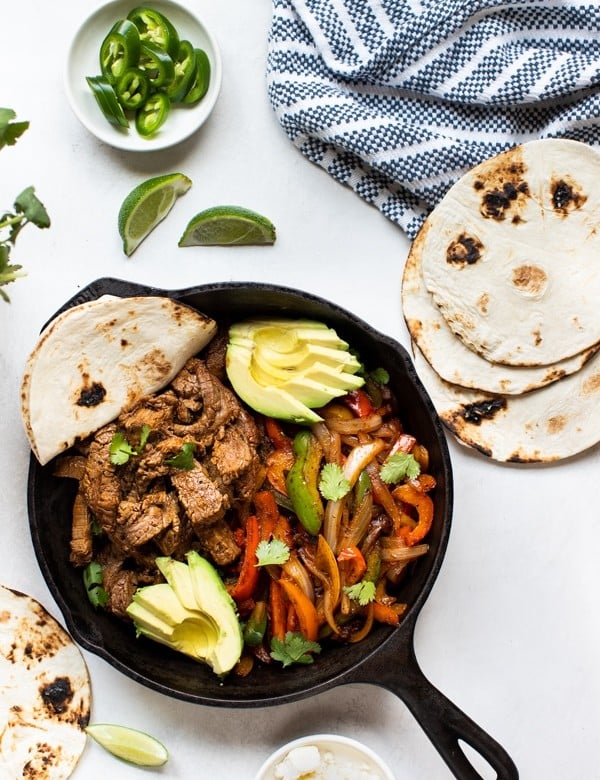steak fajitas in a cast iron skillet