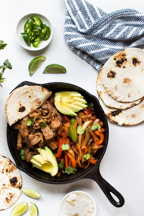 steak fajitas in a cast iron skillet