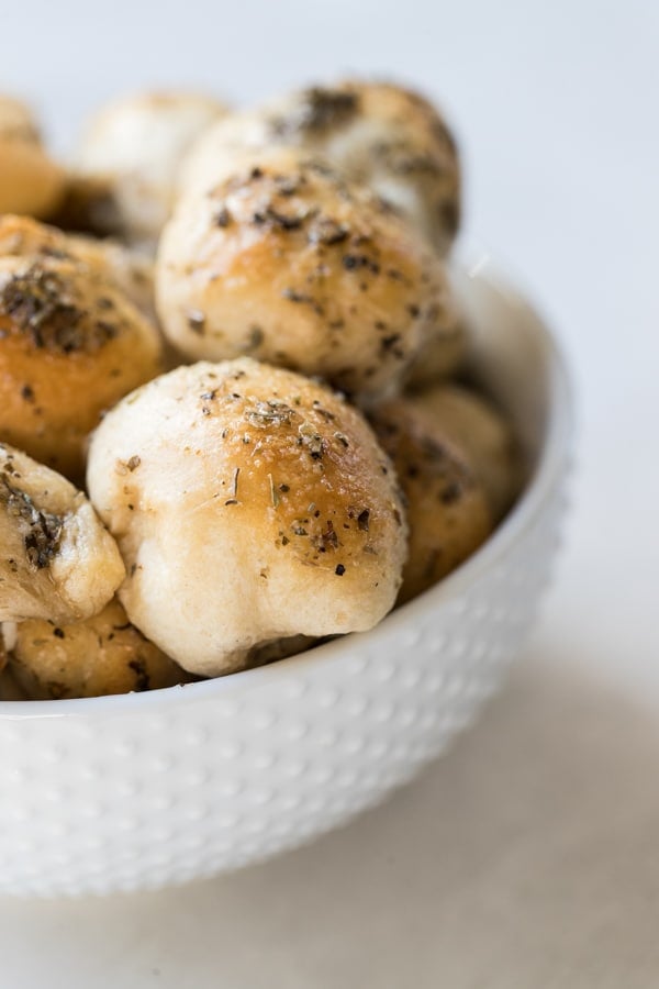 bread stuffed with cheese in a white bowl