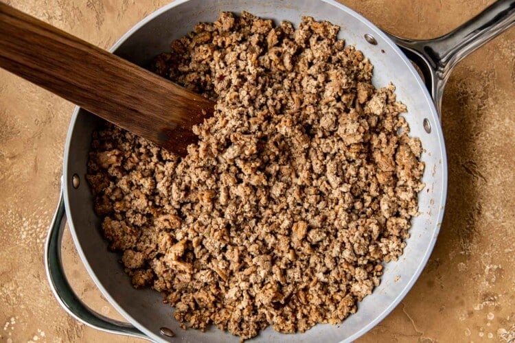 ground meat in a frying pan.